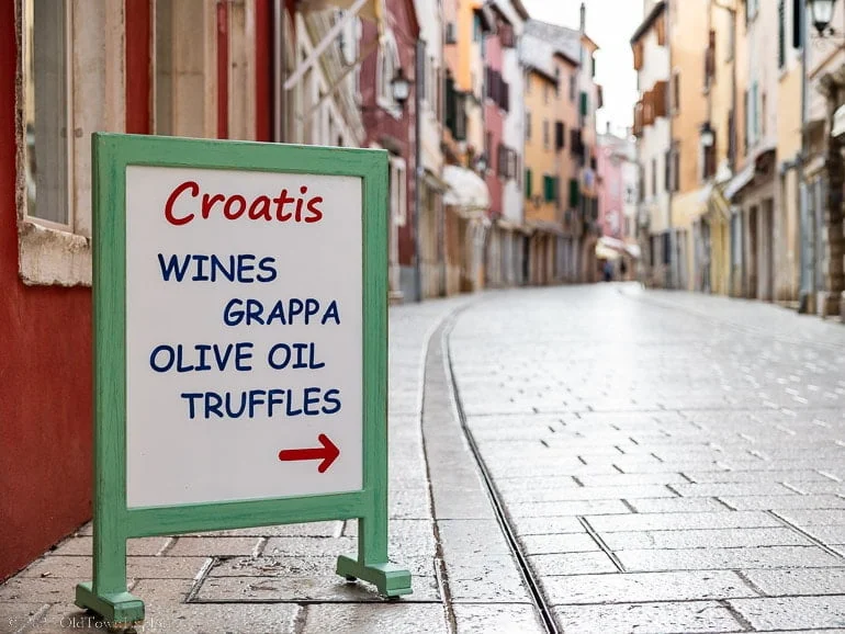 sign for wines, grappa, olive oil, and truffles in Rovinj, Croatia
