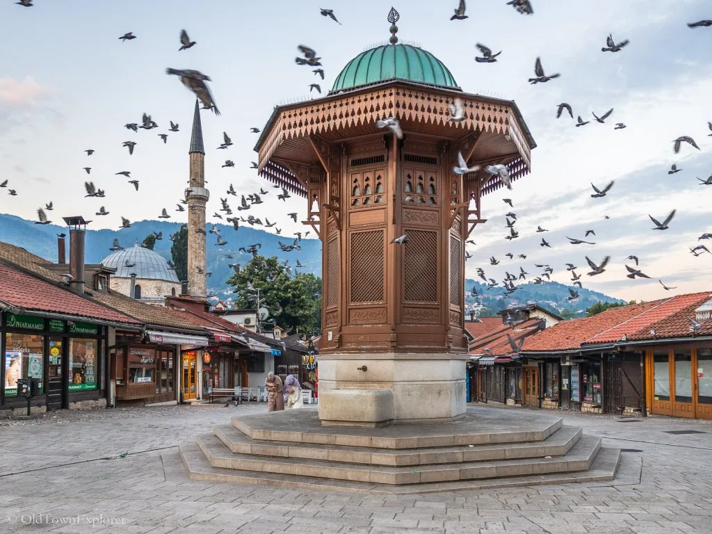Mostar, Bosnia Sebilj Fountain in Sarajevo, Bosnia with pigeons flying
